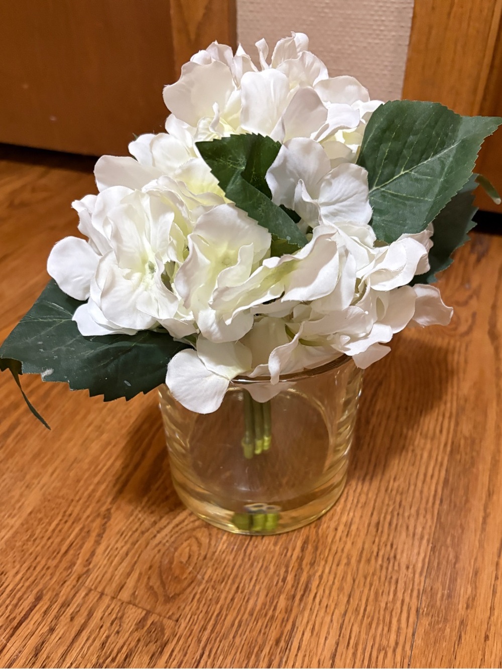 Pottery Barn composed faux white florals in glass vase